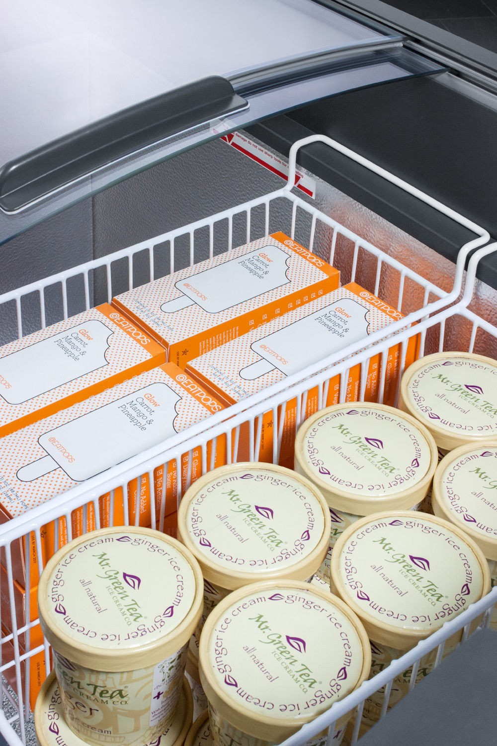 Curved top commercial ice cream freezer with sliding glass lid, digital thermostat, novelty baskets, and 12.4 cu.ft. interior